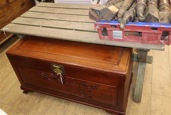 A weathered teak X frame garden table L.152cm